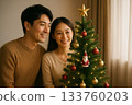 Christmas tree and smiling couple 0159 133760203