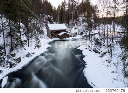 winter river flowing by old wooden mill in snowy finnish forest in National park Oulanka winter river flowing by old wooden mill in snowy finnish forest in National park Oulanka 133760476