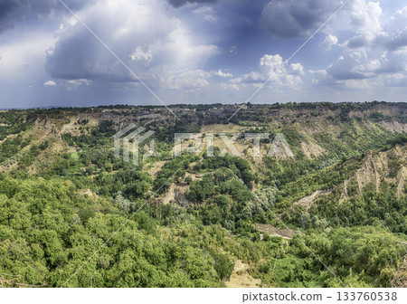 Hilltop town Civita di Bagnoregio and dramatic Italian calanchi landscape Hilltop town Civita di Bagnoregio and dramatic Italian calanchi landscape 133760538