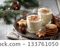 Eggnog Christmas milk cocktail with cinnamon, served in two glasses on vintage tray with shortbread star shape sugar cookies 133761050
