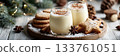Eggnog Christmas milk cocktail with cinnamon, served in two glasses on vintage tray with shortbread star shape sugar cookies 133761051