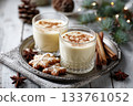 Eggnog Christmas milk cocktail with cinnamon, served in two glasses on vintage tray with shortbread star shape sugar cookies 133761052