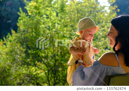 Mother and Baby Enjoying a Sunny Day in the Park 133762874