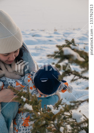 Mother and Baby in Winter Wonderland 133762913