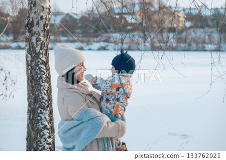 Mother and Baby in Winter Wonderland Mother and Baby in Winter Wonderland 133762921