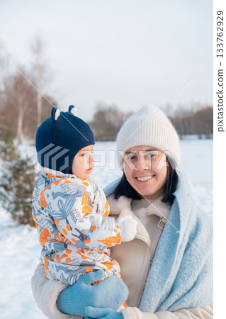 Mother and Baby Enjoying a Winter Day Mother and Baby Enjoying a Winter Day 133762929