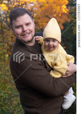 Father and Baby Enjoying Autumn Sunlight Father and Baby Enjoying Autumn Sunlight 133763007