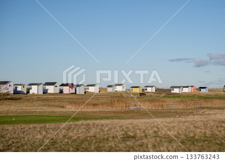 colorful beach huts in tall coastal grass on the Baltic Sea coast 133763243