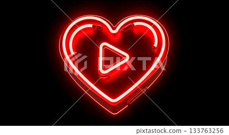 Red neon heart shape with play button symbol inside glowing in dark room online dating and adult video content concept 133763256