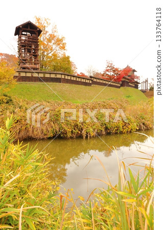 Sakai Castle walls and Iro Yagura surrounded by autumn leaves 133764118