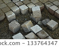 Closeup of granit cobbles in a site construction 133764347