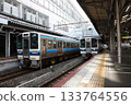 213 series train stopping at Okayama Station 133764556