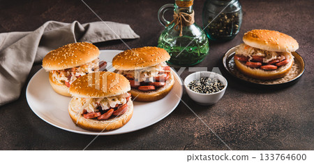 New York-style buns with sausage and sauerkraut on a plate on a table web banner New York-style buns with sausage and sauerkraut on a plate on a table web banner 133764600
