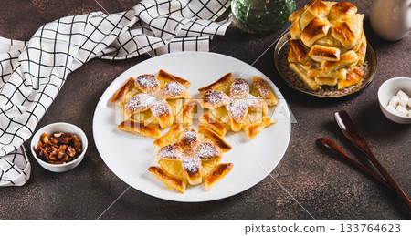 Sweet puff pastries with pineapple in powdered sugar on the table web banner Sweet puff pastries with pineapple in powdered sugar on the table web banner 133764623