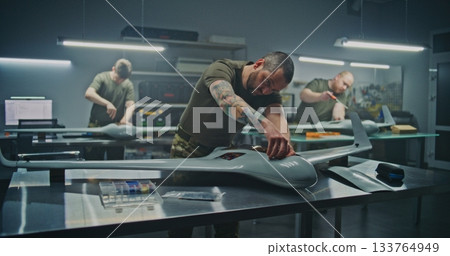 Concentrated Engineer Assembling Drone Internal Components Concentrated Engineer Assembling Drone Internal Components 133764949