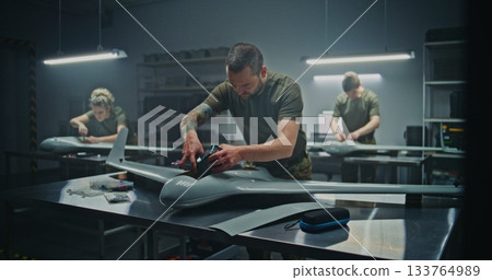 Collective Effort Team Meticulously Assembling Strategic Defense UAV 133764989