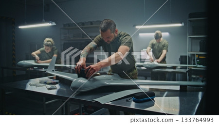 Collective Effort Team Meticulously Assembling Strategic Defense UAV Collective Effort Team Meticulously Assembling Strategic Defense UAV 133764993