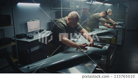 Installing Flight Electronics Technician Working on UAVs Core Installing Flight Electronics Technician Working on UAVs Core 133765010