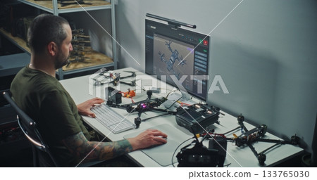 Engineer Testing FPV Drone Electronics, Connecting Wires and Checking Drone Flight Parameters Engineer Testing FPV Drone Electronics, Connecting Wires and Checking Drone Flight Parameters 133765030