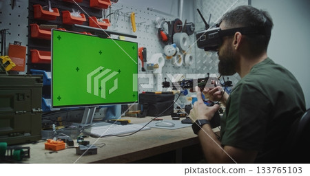 Engineer Building Drone With Dedicated Computer Display 133765103
