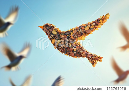Bird made of leaves soars among real birds in a serene sky filled with clouds Bird made of leaves soars among real birds in a serene sky filled with clouds 133765956