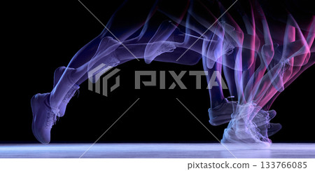 Dynamic motion-trail silhouette of running legs on dark background Dynamic motion-trail silhouette of running legs on dark background 133766085
