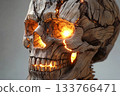 Wooden skull with glowing cracks revealing sunlight in creative display 133766471
