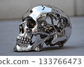 Skull melts into liquid metal in a striking artistic display 133766473