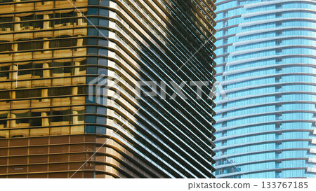 Architectural Background of Two Curved Office Towers. Geometric pattern with reflective surfaces. 133767185