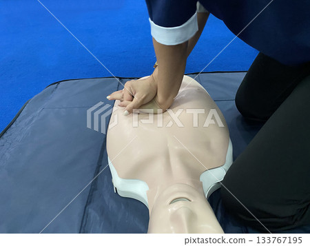 Cardiopulmonary Resuscitation (CPR) Training on a Manikin Dummy. First aid and life-saving procedure demonstration. Cardiopulmonary Resuscitation (CPR) Training on a Manikin Dummy. First aid and life-saving procedure demonstration. 133767195