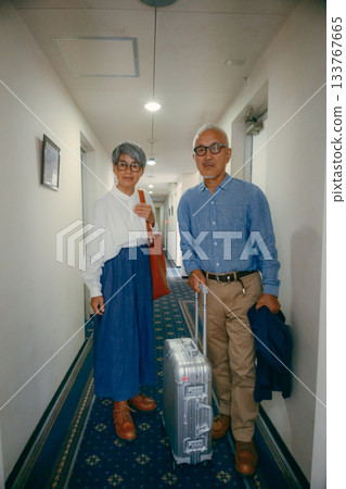 Travel scene of a senior couple riding an elevator Travel scene of a senior couple riding an elevator 133767665
