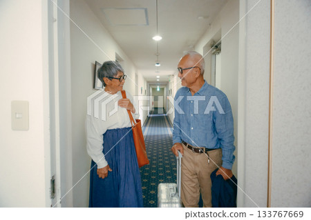 Travel scene of a senior couple riding an elevator 133767669