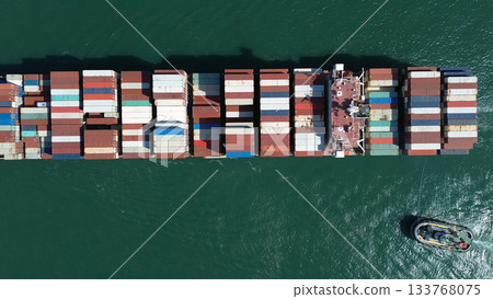 Cargo ship filled with containers in port area 133768075