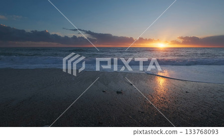 Sunset over sea with vibrant colors 133768093