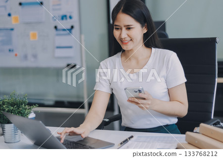 Online payment, Hands of woman holding a credit card and using smart phone for online shopping Online payment, Hands of woman holding a credit card and using smart phone for online shopping 133768212