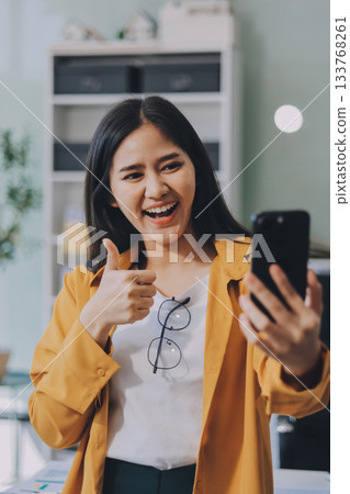 Business woman using calculator for do math finance on wooden desk in office and business working background, tax, accounting, statistics and analytic research concept. 133768261