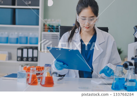 Portrait, science and happy woman on laptop in lab to research chemistry, test or innovation. Microscope, scientist and face of medical doctor in goggles for microbiology, healthcare or pharma study Portrait, science and happy woman on laptop in lab to research chemistry, test or innovation. Microscope, scientist and face of medical doctor in goggles for microbiology, healthcare or pharma study 133768284