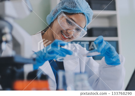 Portrait, science and happy woman on laptop in lab to research chemistry, test or innovation. Microscope, scientist and face of medical doctor in goggles for microbiology, healthcare or pharma study Portrait, science and happy woman on laptop in lab to research chemistry, test or innovation. Microscope, scientist and face of medical doctor in goggles for microbiology, healthcare or pharma study 133768290