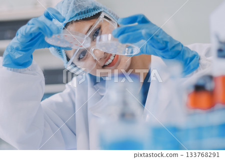 Portrait, science and happy woman on laptop in lab to research chemistry, test or innovation. Microscope, scientist and face of medical doctor in goggles for microbiology, healthcare or pharma study Portrait, science and happy woman on laptop in lab to research chemistry, test or innovation. Microscope, scientist and face of medical doctor in goggles for microbiology, healthcare or pharma study 133768291