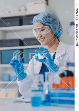 Portrait, science and happy woman on laptop in lab to research chemistry, test or innovation. Microscope, scientist and face of medical doctor in goggles for microbiology, healthcare or pharma study Portrait, science and happy woman on laptop in lab to research chemistry, test or innovation. Microscope, scientist and face of medical doctor in goggles for microbiology, healthcare or pharma study 133768296