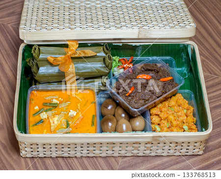 Traditional Indonesian Food Hamper with Rendang and Lontong in Bamboo Box Traditional Indonesian Food Hamper with Rendang and Lontong in Bamboo Box 133768513