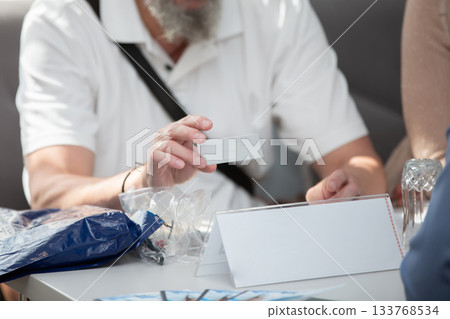 Hands of an unrecognizable male businessman at the negotiating table. Concept of persuasion and cooperation. 133768534