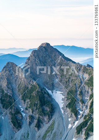 View of Maehotakadake and the north ridge during the magic hour from the terrace of Kitahotaka hut. Climbing Kitahotakadake in the Northern Alps 133769861