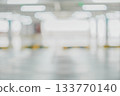 Abstract blurred indoor parking space with glowing white lights and soft tones 133770140