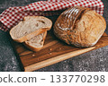 Fresh baked sourdough loaf and slices close up 133770298