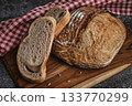 Whole grain sourdough bread with cut slices 133770299
