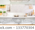 Marble countertop with blurred modern kitchen background 133770304