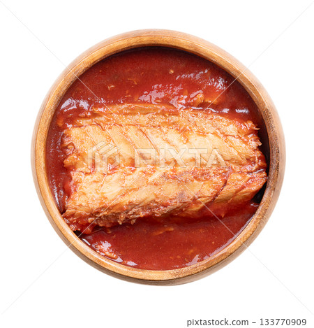 Canned mackerel fillet in tomato sauce, in a wooden bowl. Cooked mackerel piece, skinless and boneless, with tomato sauce. Rich source of protein, vitamins and omega-3 fatty acids. Isolated. Photo Canned mackerel fillet in tomato sauce, in a wooden bowl. Cooked mackerel piece, skinless and boneless, with tomato sauce. Rich source of protein, vitamins and omega-3 fatty acids. Isolated. Photo 133770909