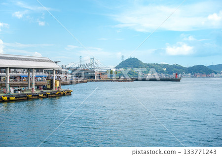 Summer seascape of the Kanmon Straits overlooking Shimonoseki Karato Market and the Kanmon Bridge 133771243