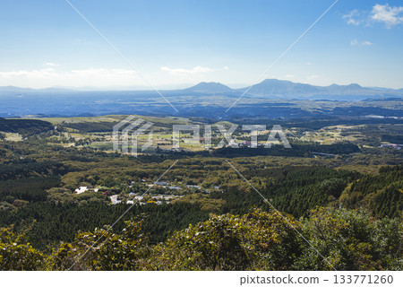 A panoramic view of Mount Aso and its outer rim from Handa Plateau, with blue skies A panoramic view of Mount Aso and its outer rim from Handa Plateau, with blue skies 133771260